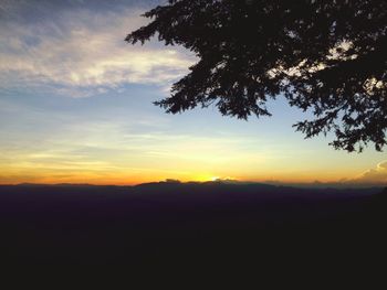 Scenic view of silhouette landscape against sky at sunset