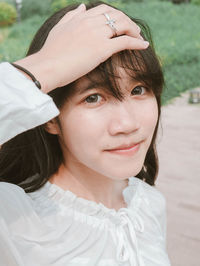 Close-up portrait of a smiling young woman