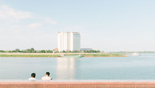 Rear view of people on water