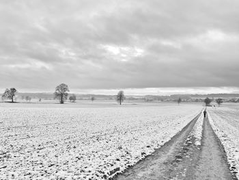 Scenic view of land against sky during winter