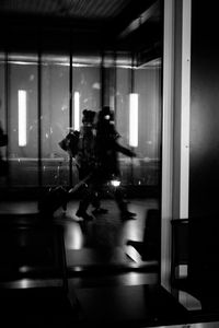 View of woman in dark room