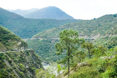 Scenic view of landscape and mountains against sky
