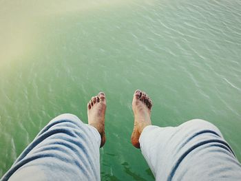 Low section of man legs in water