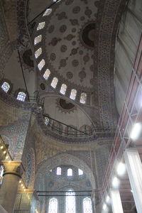 Low angle view of illuminated ceiling of building