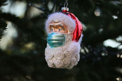 Close-up of christmas decoration hanging on tree