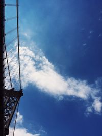 Low angle view of tower against blue sky
