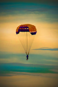 Parasailing parachute on sunset at pattaya beach thailand