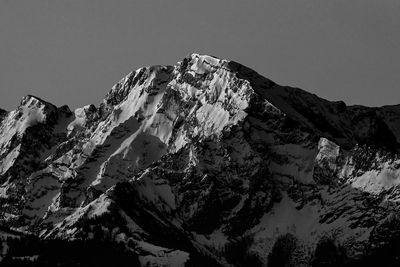 Scenic view of snowcapped mountains against clear sky