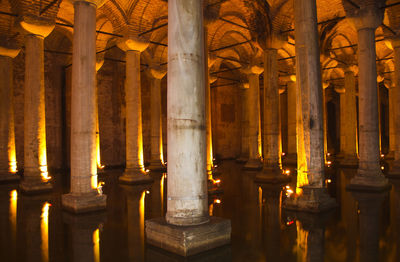 View of illuminated colonnade in building