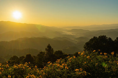 Scenic view of mountains against sky during sunset