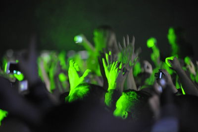 Close-up of hand holding illuminated light at night