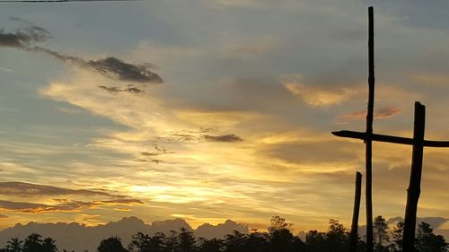 Low angle view of silhouette trees against sky during sunset