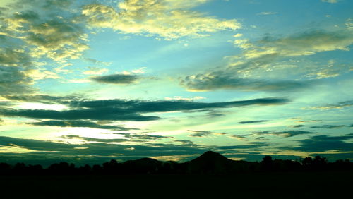 Scenic view of silhouette landscape against sky during sunset