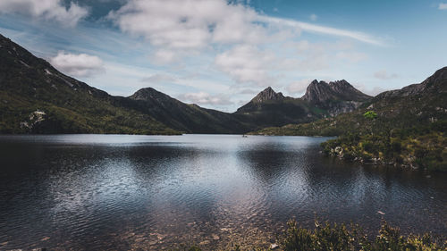 Scenic view of lake and mountains against sky