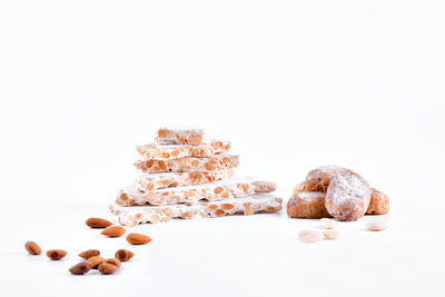 Close-up of stack on table against white background