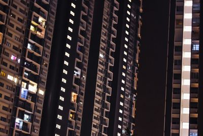 Low angle view of illuminated buildings in city