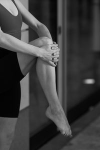 Low section of woman exercising in gym