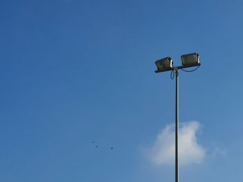 Low angle view of street light against sky