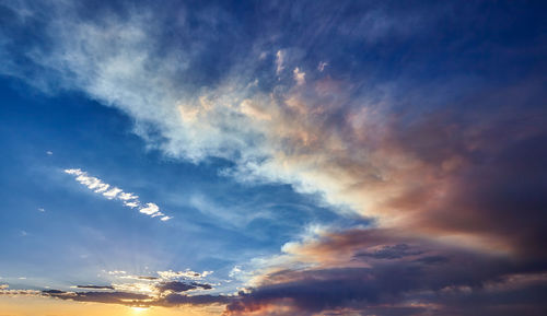 Low angle view of clouds in sky during sunset