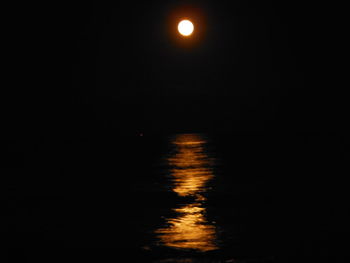 Scenic view of sea against sky at night