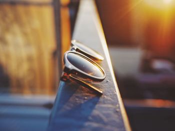 Close-up of sunglasses on metal