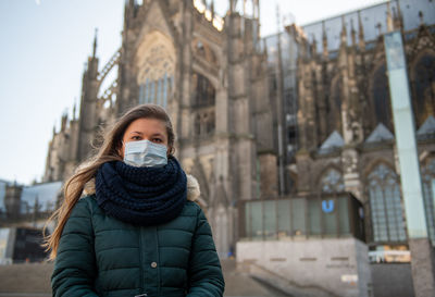 Portrait of beautiful woman in city