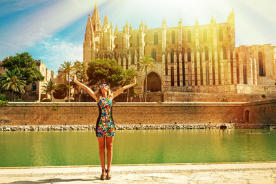 Woman standing in front of building