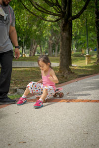 Side view of woman walking on road