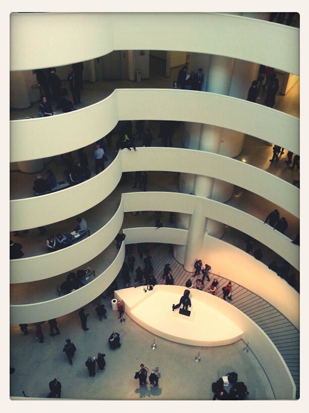 transfer print, architecture, built structure, large group of people, building exterior, indoors, auto post production filter, high angle view, men, city, modern, building, in a row, person, city life, day, lifestyles, arrangement, reflection