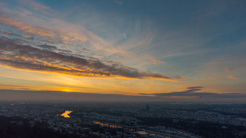 High angle view of buildings against sky during sunset