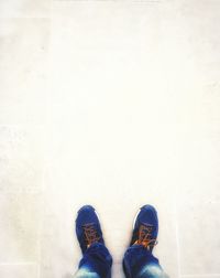 Low section of man standing on floor