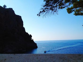 Scenic view of sea against clear blue sky