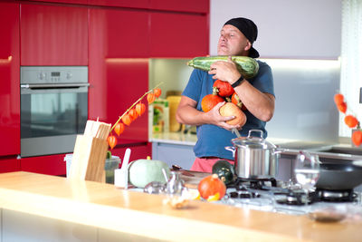 Man preparing food in kitchen at home