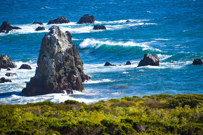 Bigsur california pacific coast highway view of blue ocean waves crashing on rocks