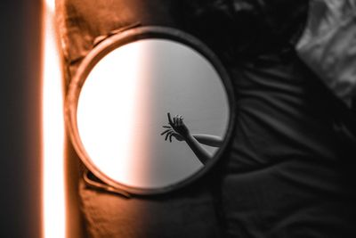 Close-up of hand on glass