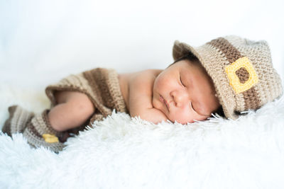 Portrait of baby sleeping in bed