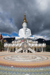 View of temple building against cloudy sky