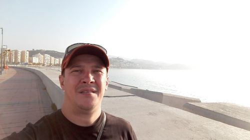 Portrait of smiling mid adult man in sea
