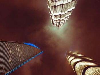 Low angle view of illuminated building against sky at night