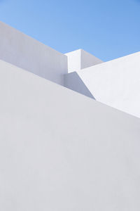 Low angle view of white building against clear sky