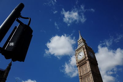 Low angle view of tower against blue sky