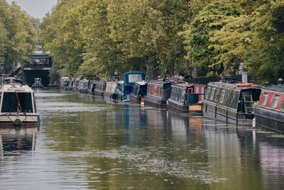 View of boats moored in river