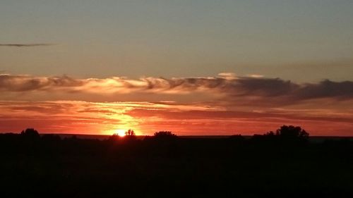 Scenic view of silhouette landscape against sky during sunset