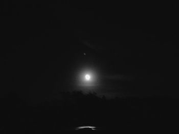 Low angle view of moon against sky at night