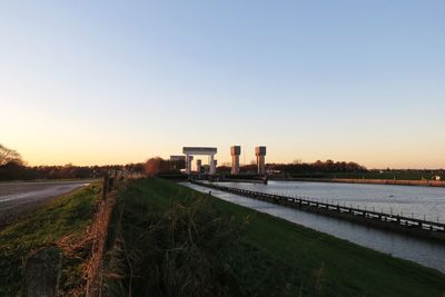 Railroad tracks against sky during sunset