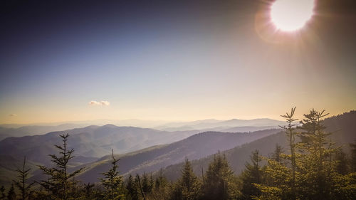 Scenic view of mountains against sky at sunset