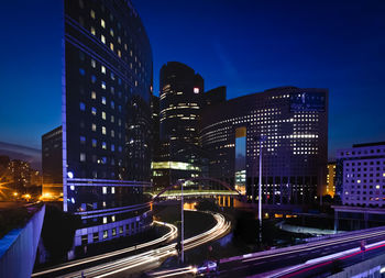 Illuminated buildings in city at night