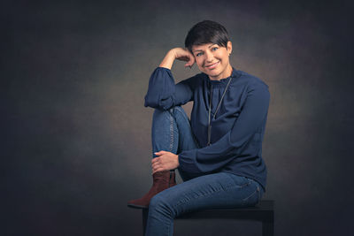 Portrait of young man sitting at home