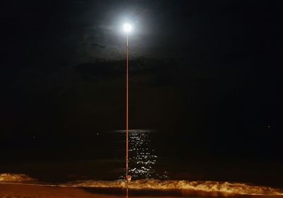 Scenic view of sea against sky at night