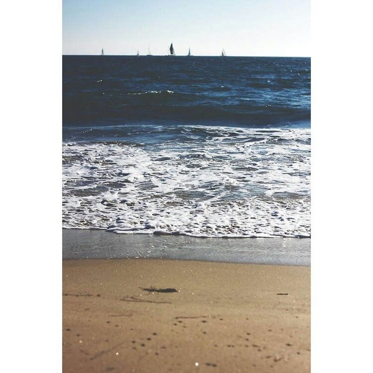 beach, sea, sand, water, shore, transfer print, wave, surf, horizon over water, tranquil scene, auto post production filter, tranquility, scenics, beauty in nature, nature, coastline, footprint, vacations, clear sky, idyllic